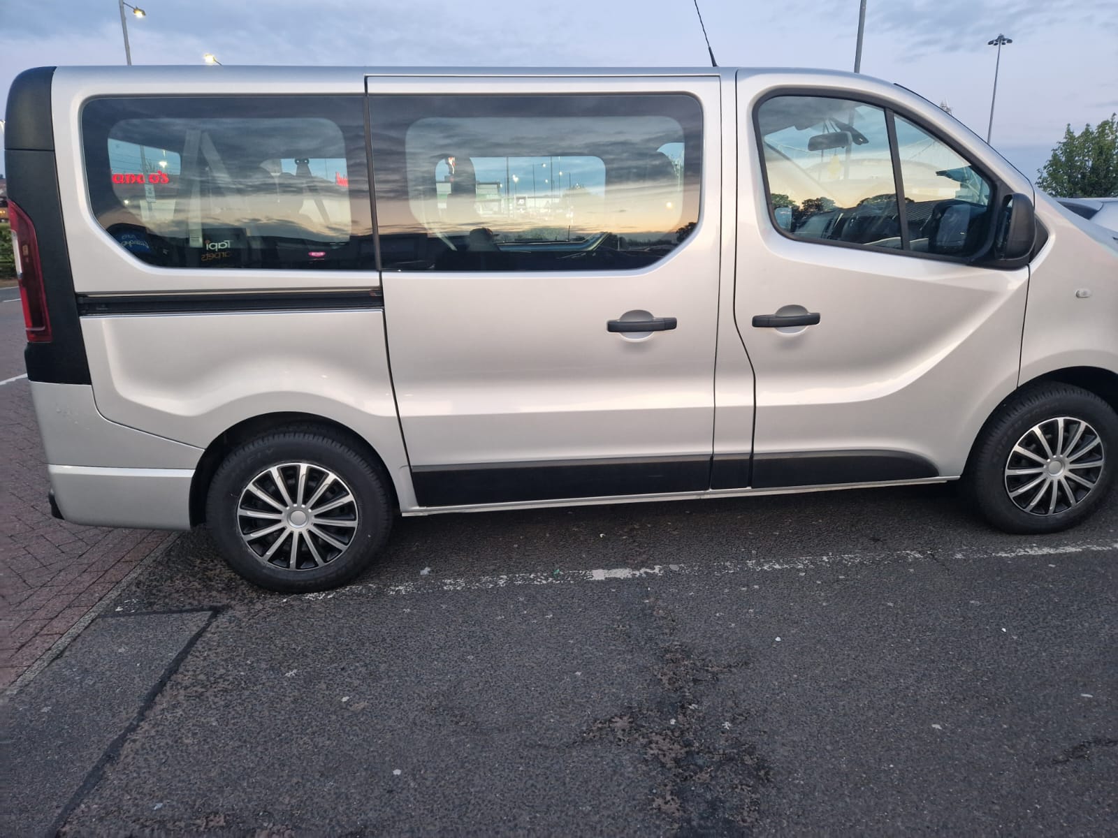 Silver eight-seat minibus used for group airport transfers